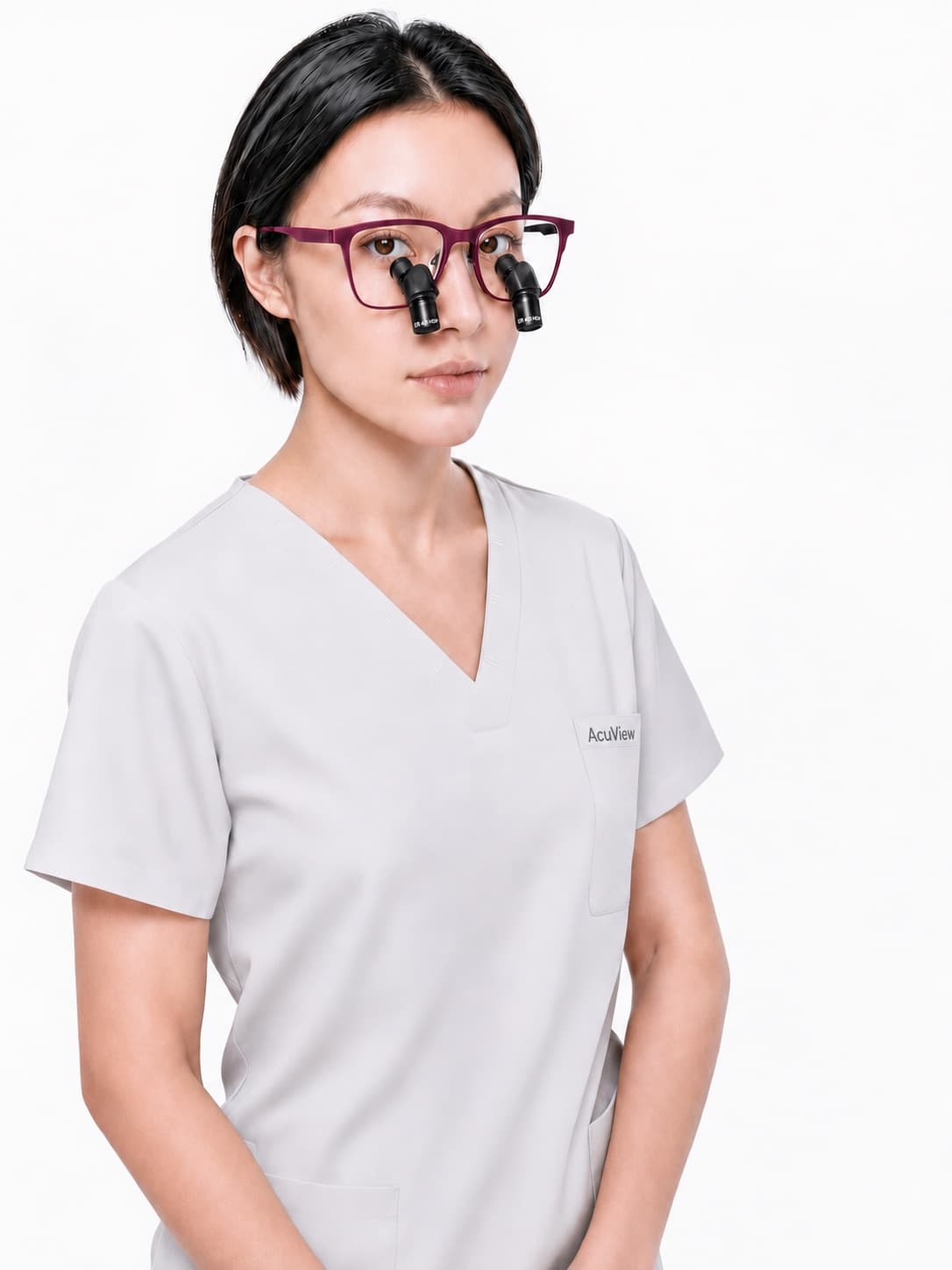 Dentist wearing AcuView Pro prismatic loupes in burgundy